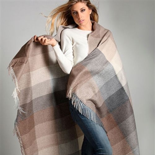 woman wrapped in Alpaca throw